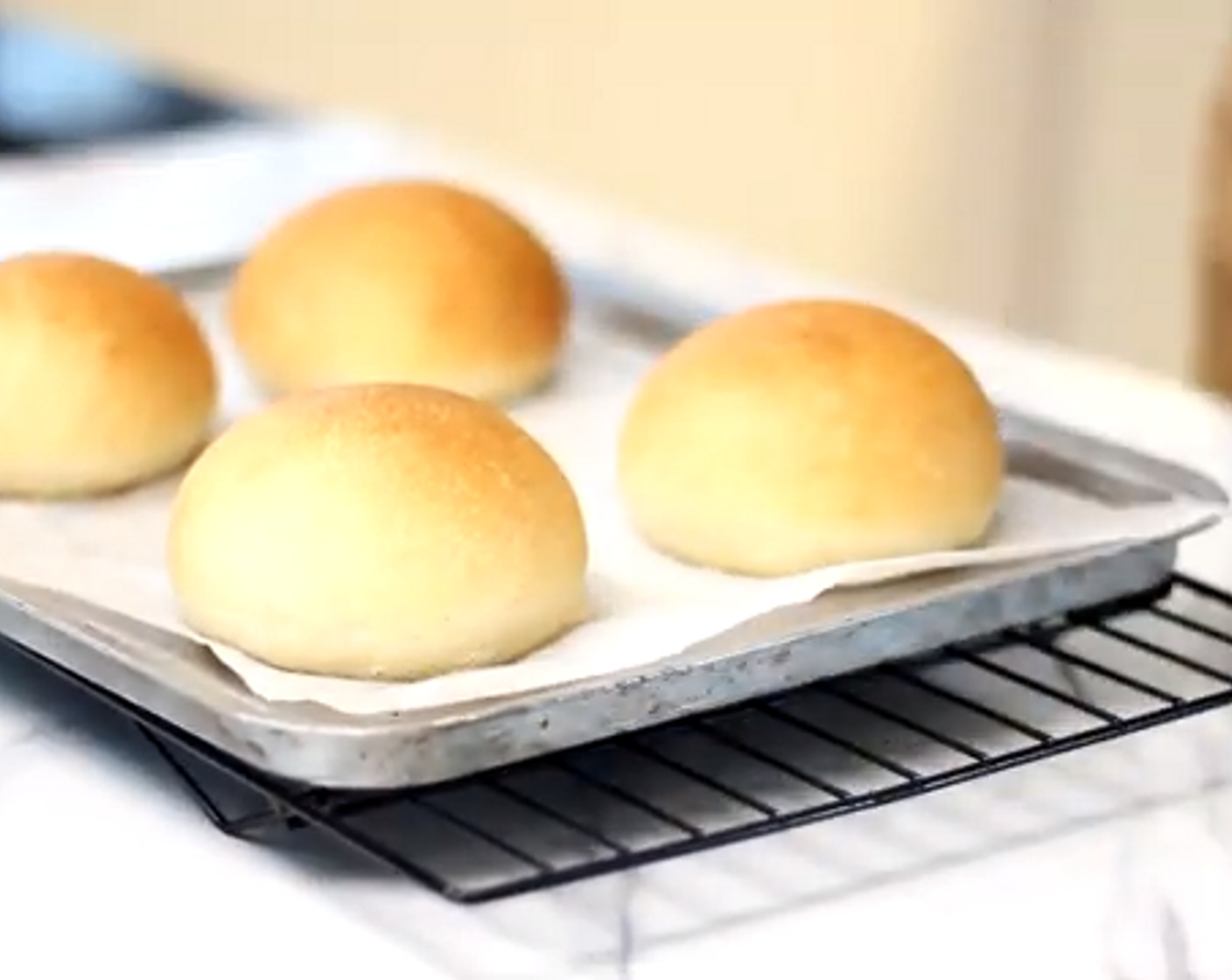 step 8 Remove the bread from the oven once golden brown and cover lightly with a kitchen towel while cooling.