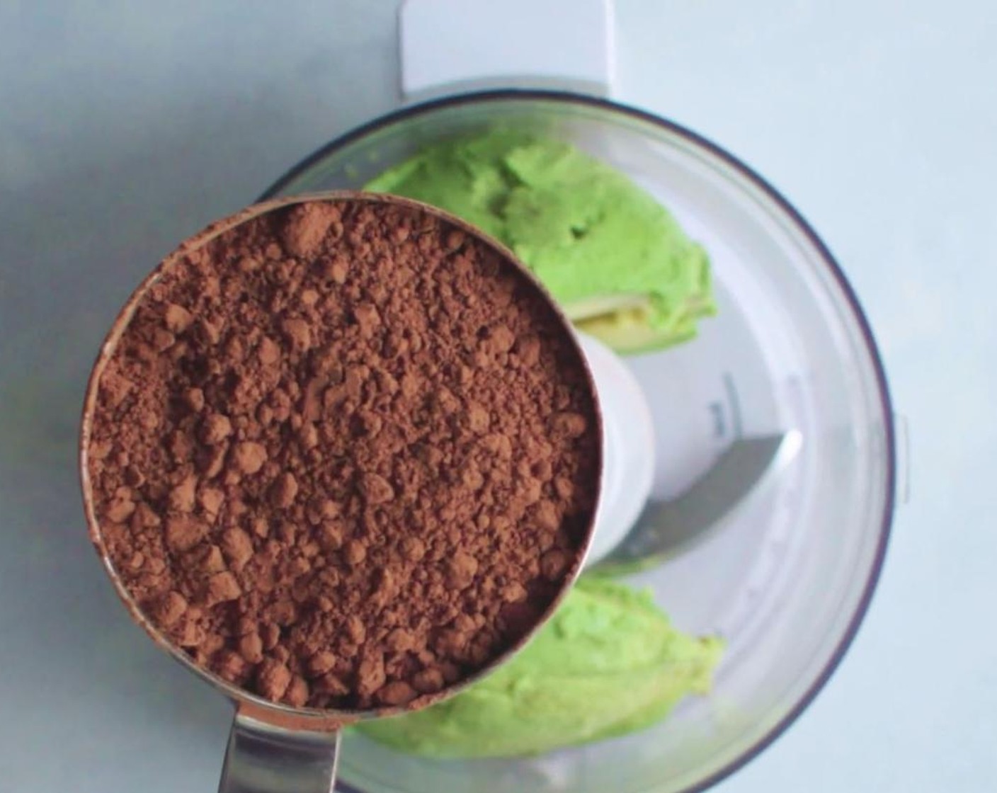step 1 Place Avocado (1), Cacao Powder (1/2 cup), Unsweetened Plain Non-Dairy Milk (1/4 cup), Agave Syrup (1/4 cup), Pure Vanilla Extract (1 tsp), and Fine Sea Salt (1 pinch) in mini food processor.