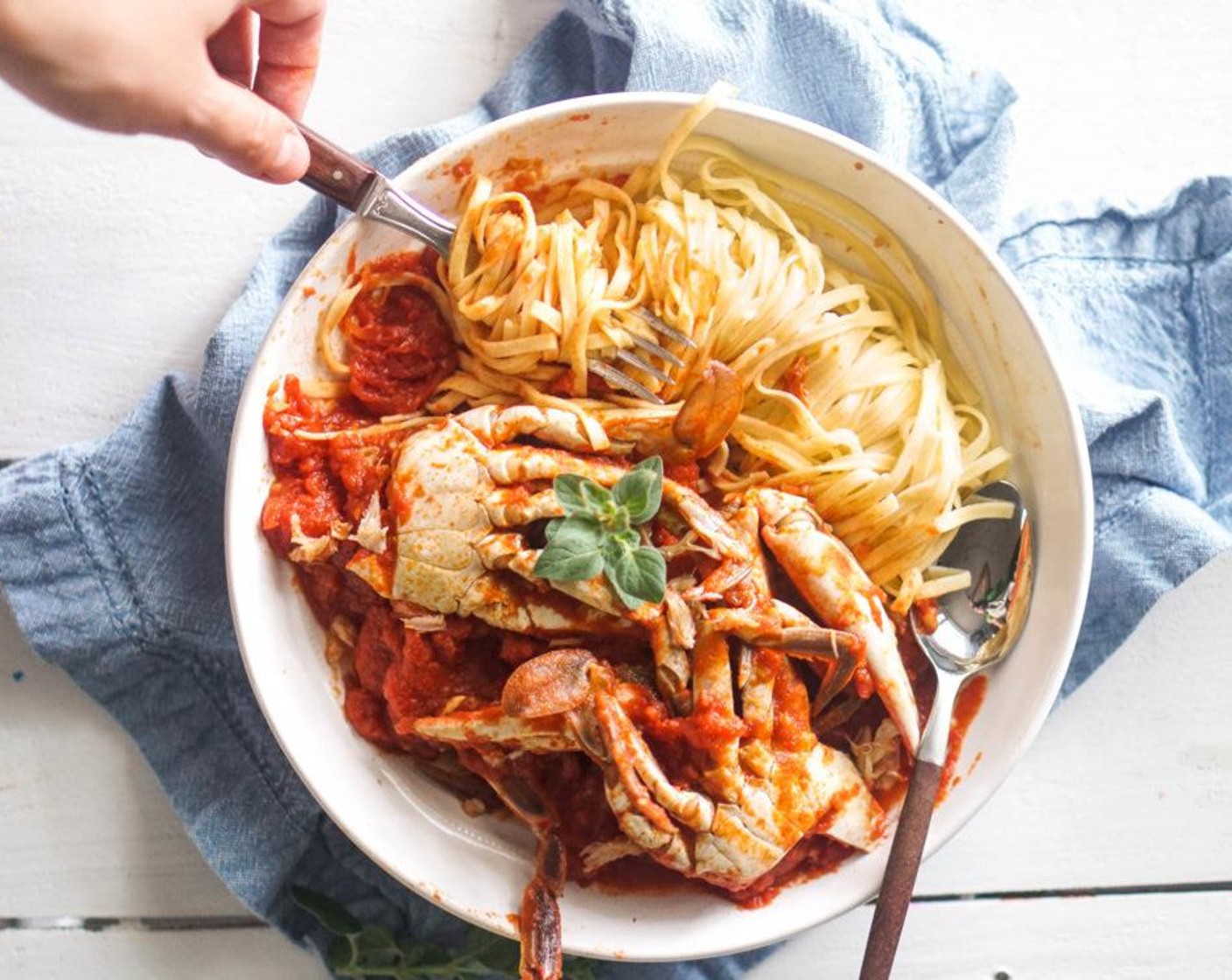 step 6 Serve the sauce over a bowl of pasta.  Be sure to supply plenty of napkins, knives to crack open the crab legs, and a bowl to discard shells. Serve and enjoy!