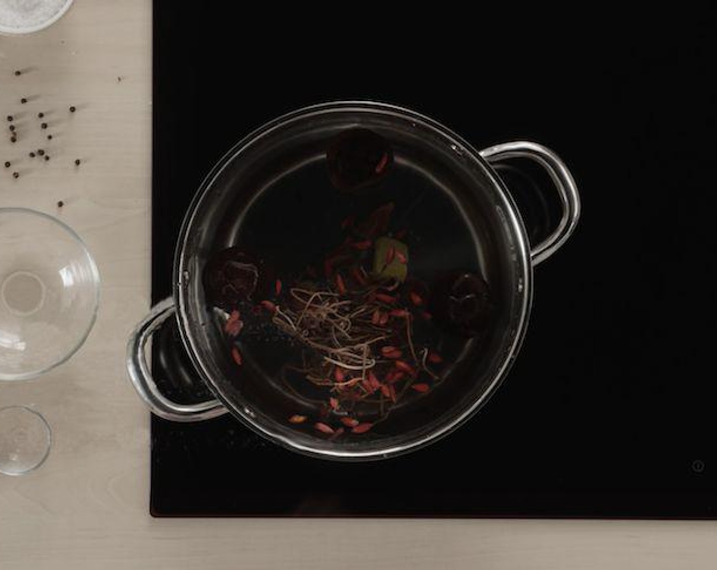 step 4 Add your ingredients in the following order: shiitake mushrooms, Dried Red Dates (2 tsp), Goji Berries (2 tsp), and Cordycep Flowers (2 tsp). Pour in the rest of the Water (1 1/2 cups) and toss a Chicken Bouillon Cube (1) into the mix for extra flavor.