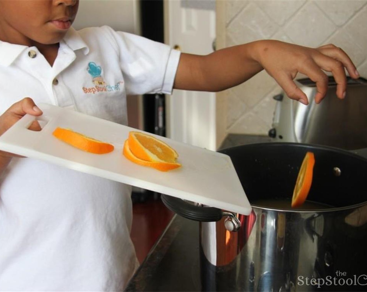 step 2 Then add orange slices and Apple Cider (16 cups) into a large pot.