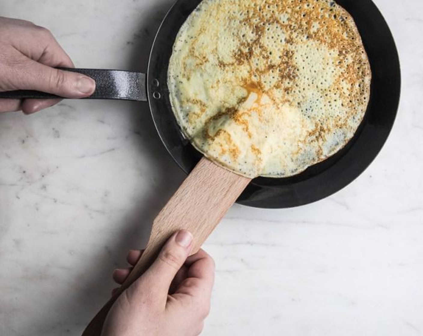 step 5 Once the crepe batter has chilled in refrigerator, heat a 7-inch crepe pan over medium low heat and add a scant 1/4 cup of crepe batter the heated pan, swirling the pan to evenly coat it with the batter.