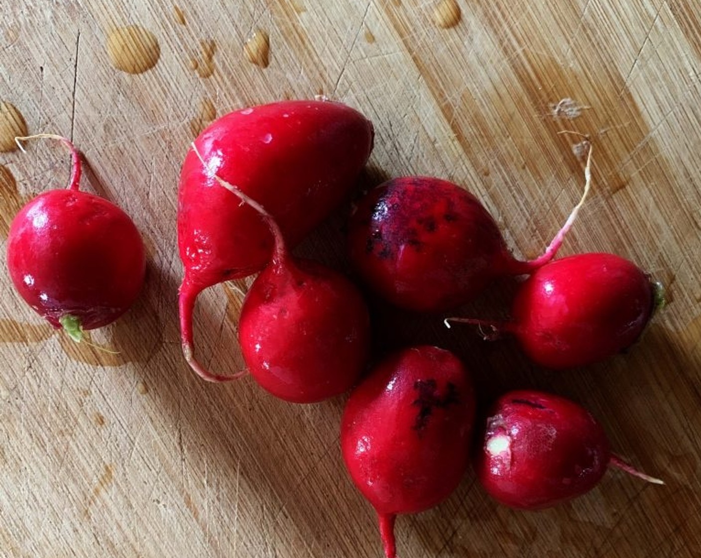 step 2 Wash the Baby Red Radish (1 bunch), cut them in half, and transfer them to a bowl.