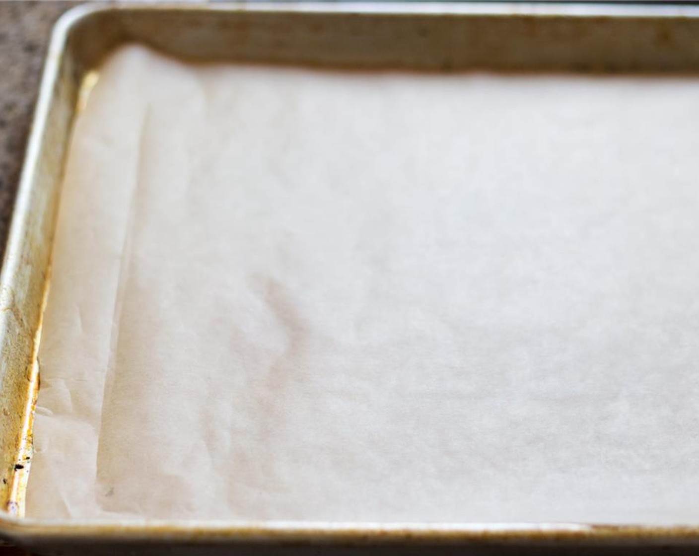 step 2 Turn the oven to 400 degrees F (200 degrees C). Line a baking sheet with parchment paper, or lightly grease the pan if you don't have the paper.