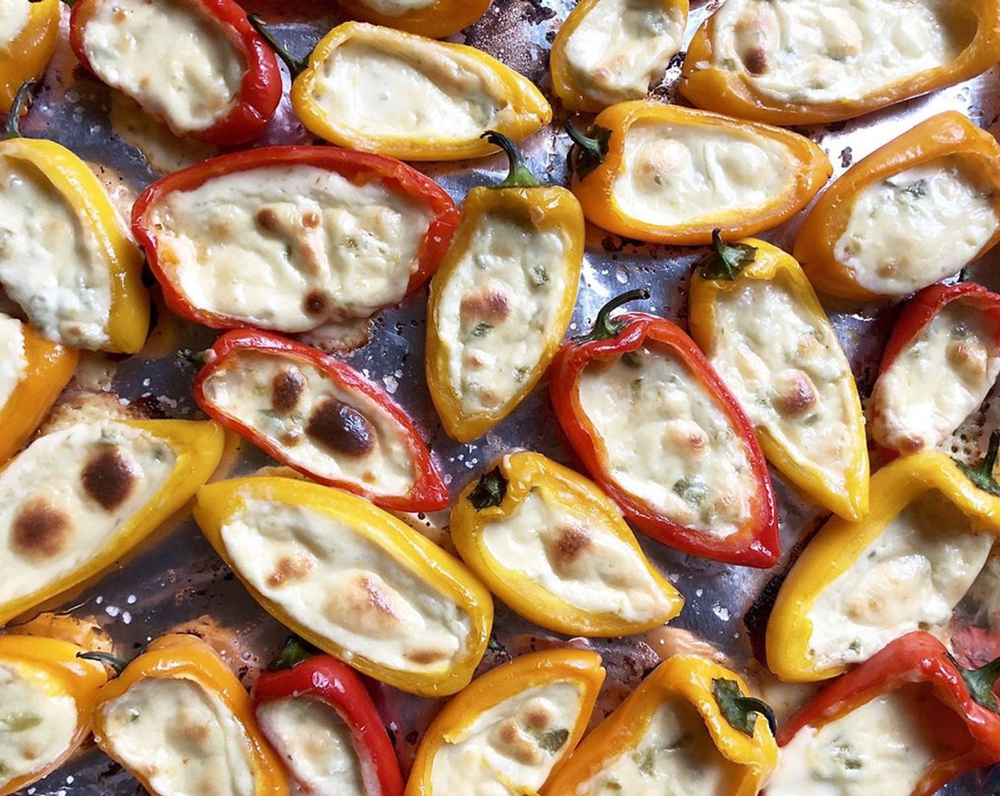 step 8 Spoon about a teaspoon of cheese mixture into each pepper; adjust accordingly depending on the size of the pepper. Do not overfill. Bake until the tops are golden for 10-12 minutes.