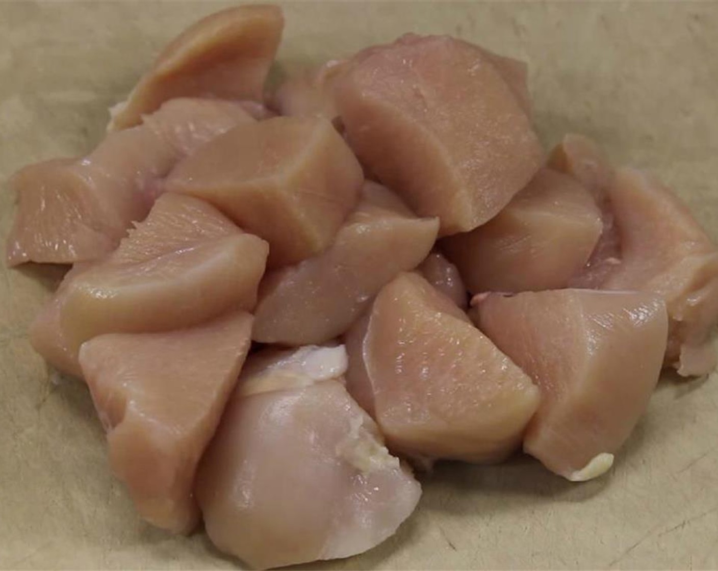 step 2 Cut the Chicken Thigh (1 lb) into strips, and then into 1-inch chunks.