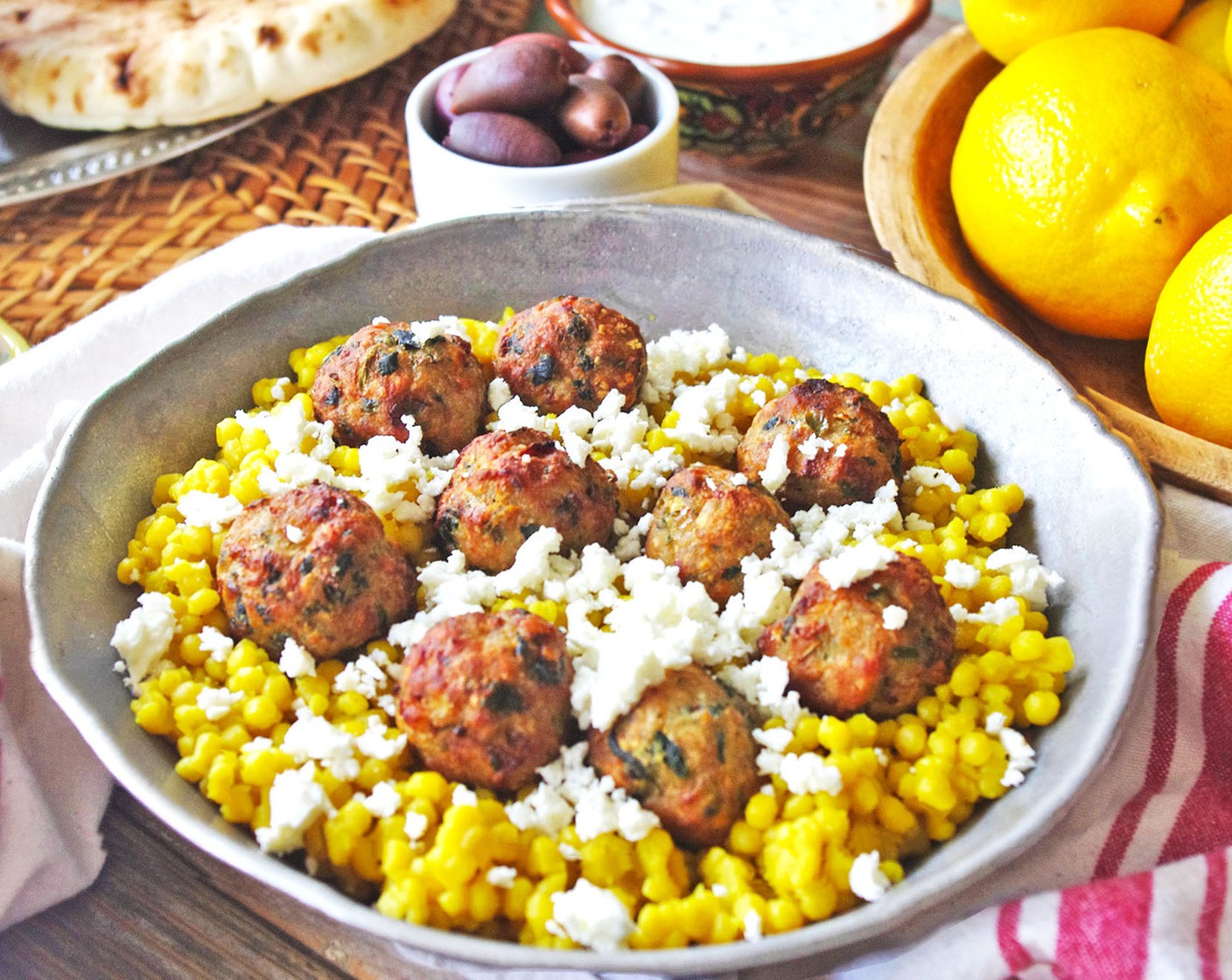 step 7 Garnish meatballs with Italian Flat-Leaf Parsley (1/2 handful) and serve with tzatziki and couscous.