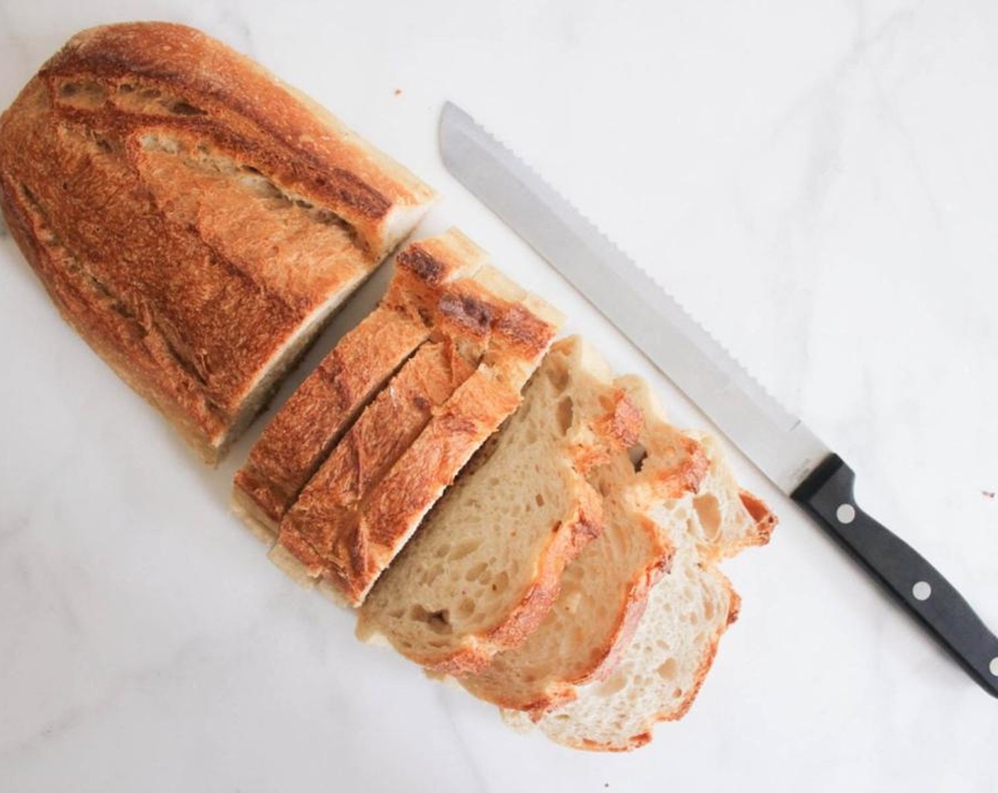 step 3 Preheat your broiler on high, and go ahead and slice your Baguettes (4 slices).