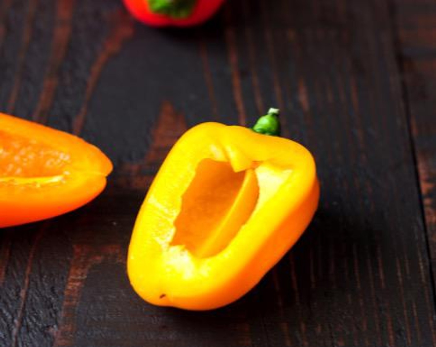 step 2 Place Baby Bell Peppers (3 cups) on a cutting board. Slice off one side of each pepper horizontally to make a pepper boat. Discard the seeds.