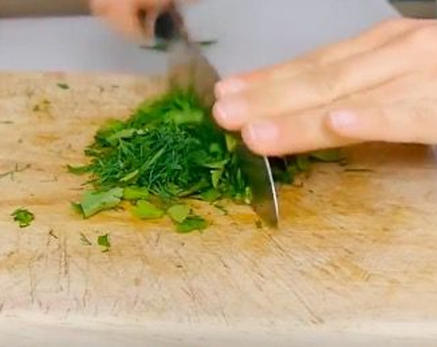 step 7 Whilst the plantain is cooling down, chop Fresh Cilantro (1 handful) and Fresh Dill (1 handful). Add it to the tuna with Lime (1).