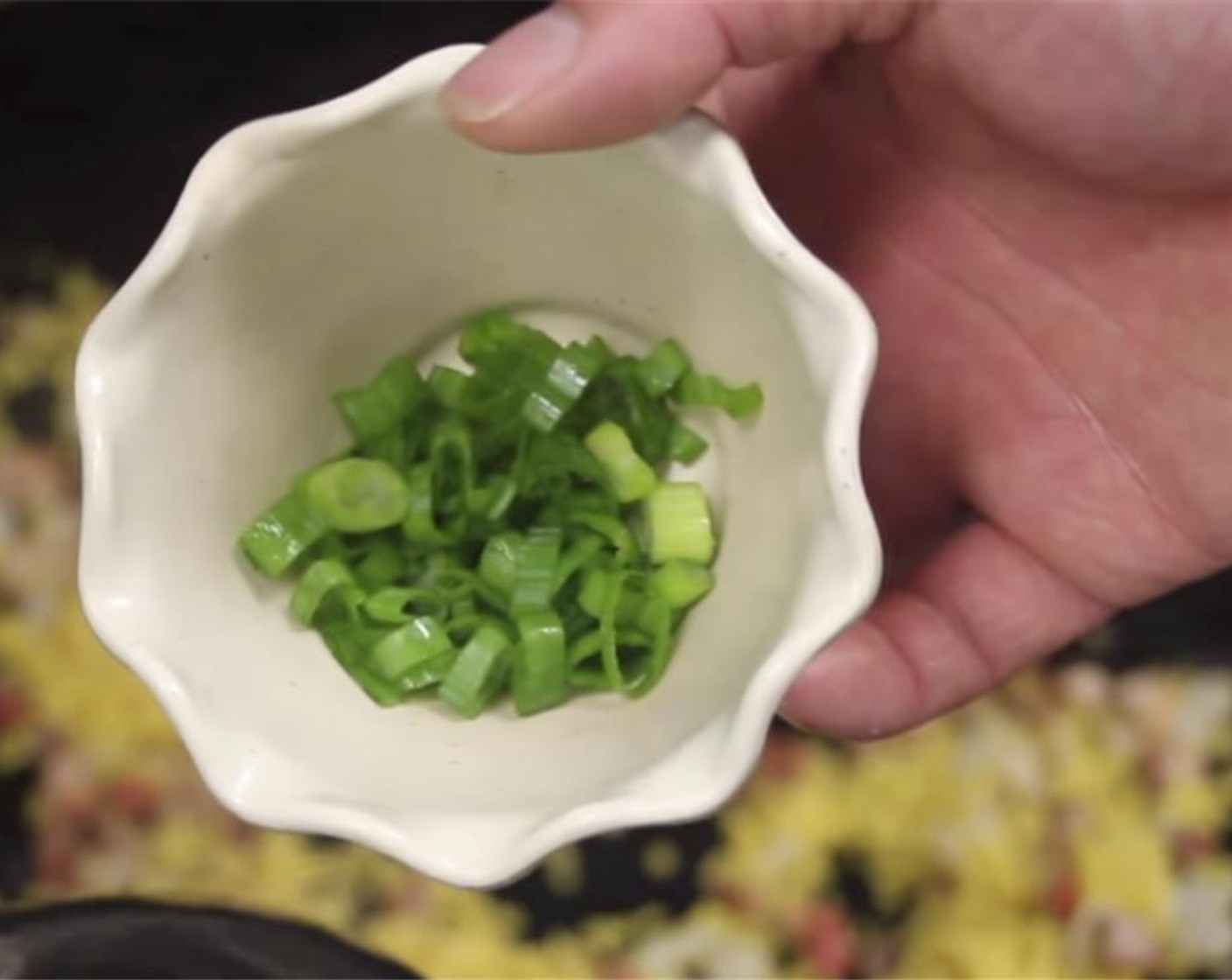 step 14 Add the the sliced green onion and Water (2 Tbsp) and continuously stir for a few seconds.