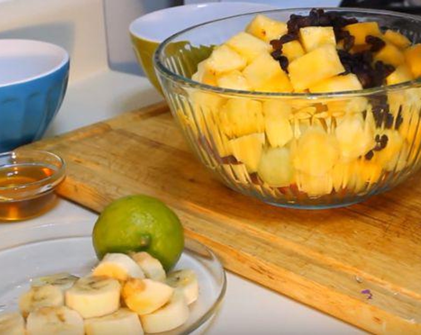 step 1 Add the Mangoes (2), Pineapples (2 cups), Honeydew Melons (2 cups), Banana (1), Raisins (1/4 cup), and Apple (1) to a large bowl.