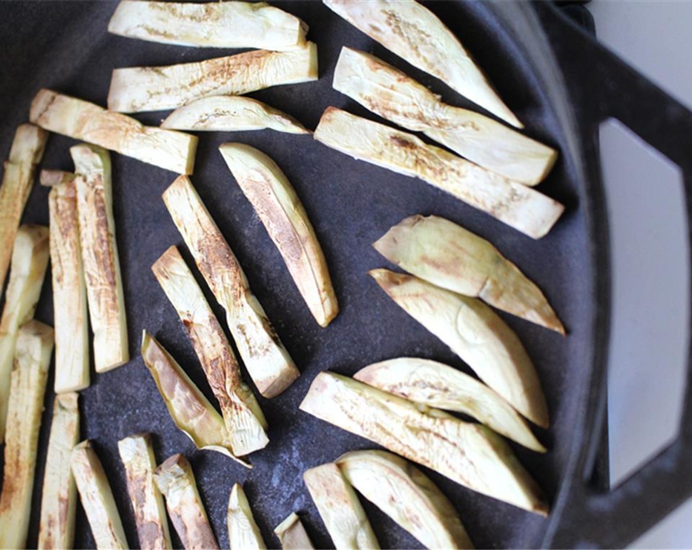 step 4 Add Olive Oil (1/2 Tbsp), salt and Chili Powder (1/4 tsp). Cook for 1 minute, flip and cook for about 1 minute more, or until eggplant is crispy.