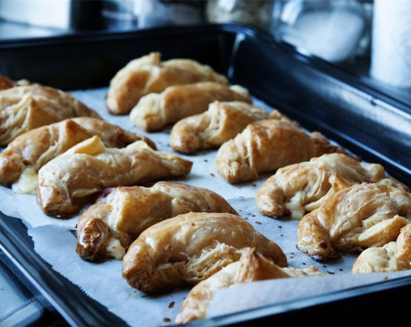 step 8 Bake at 200 degrees C (400 degrees F) for about 15-20 minutes, or until they get a nice golden-brown color. Remove from the oven and let them cool down a bit. These are best served warm (not hot), but even cold-ish they will rock your boat! Enjoy!