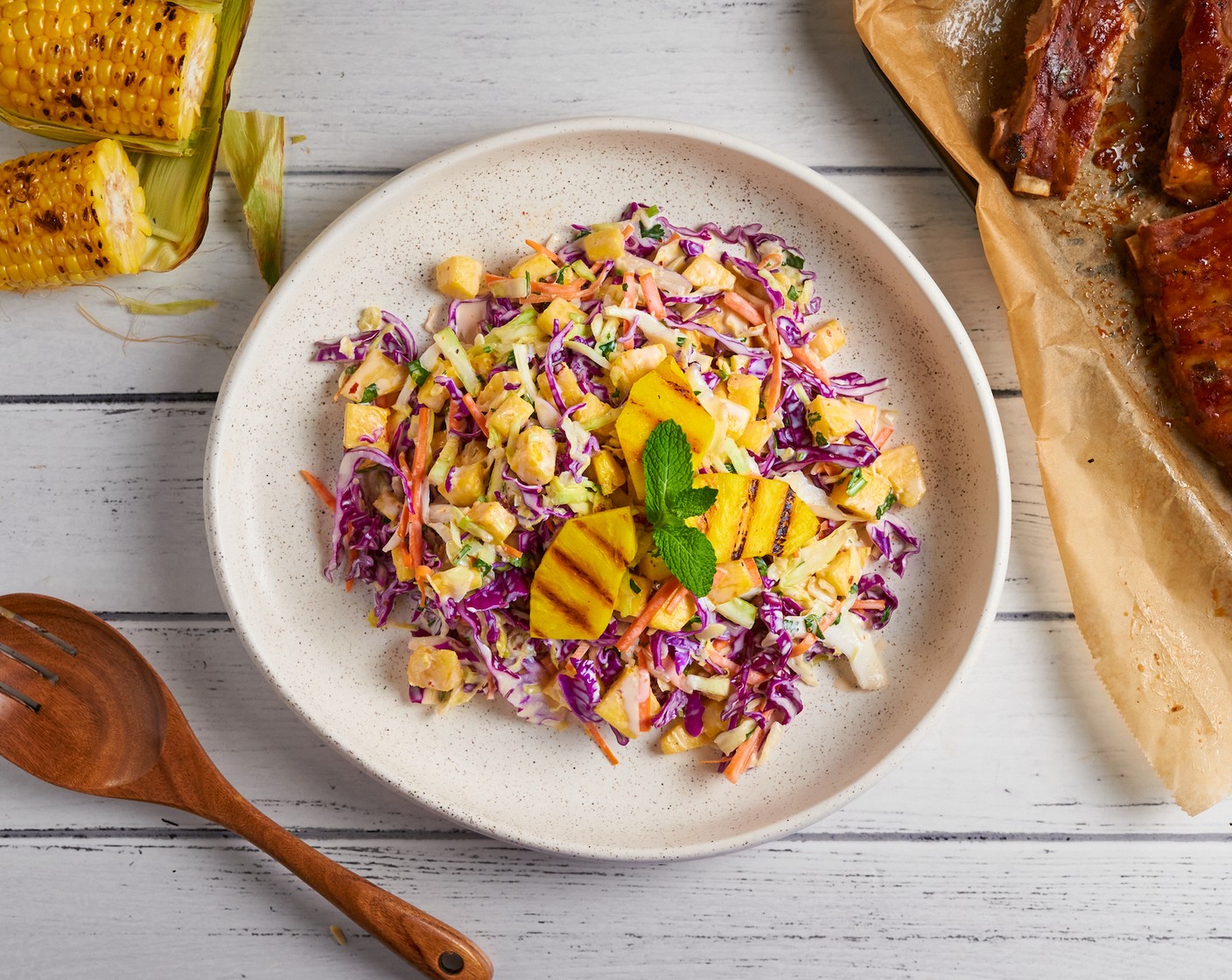 step 5 Transfer to a serving plate. Garnish with fresh mint and grilled pineapple chunks (optional). Serve.