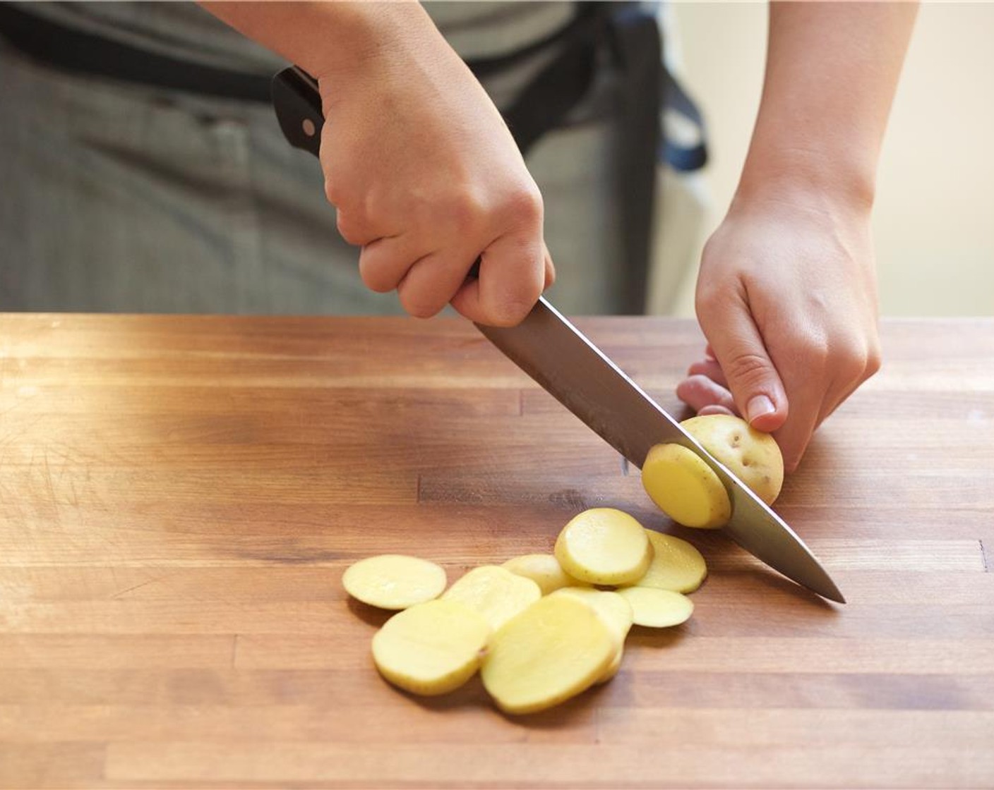 step 8 Slice Baby Yukon Gold Potatoes (2 1/4 cups) into quarter inch rounds, and place in the medium bowl with the onions.