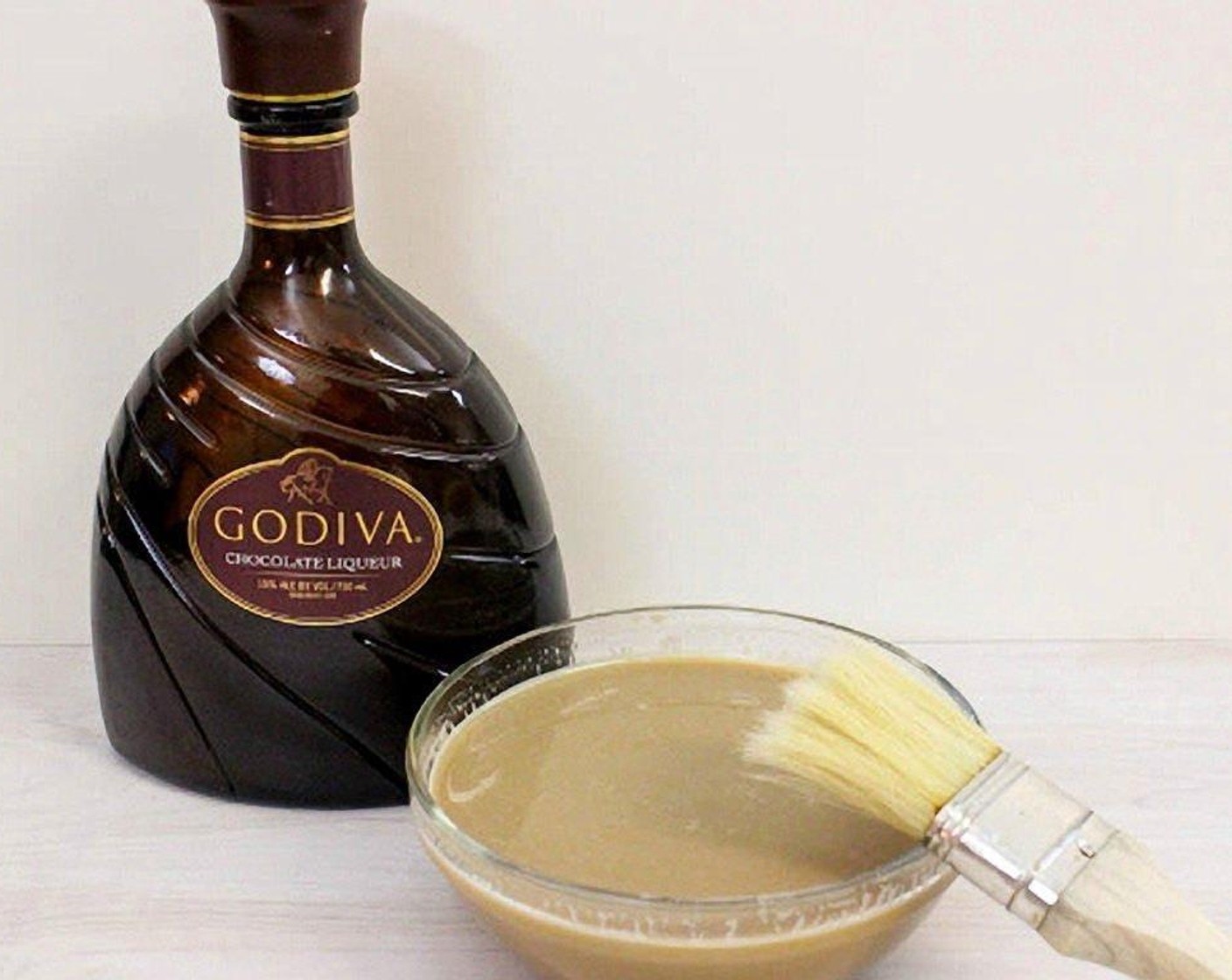 step 18 For the syrup: In a small saucepan, combine the Water (1/2 cup), Granulated Sugar (1/3 cup), and Chocolate Liqueur (1/2 cup) and cook over medium-hot heat until the sugar melts. Remove from the heat and let cool.