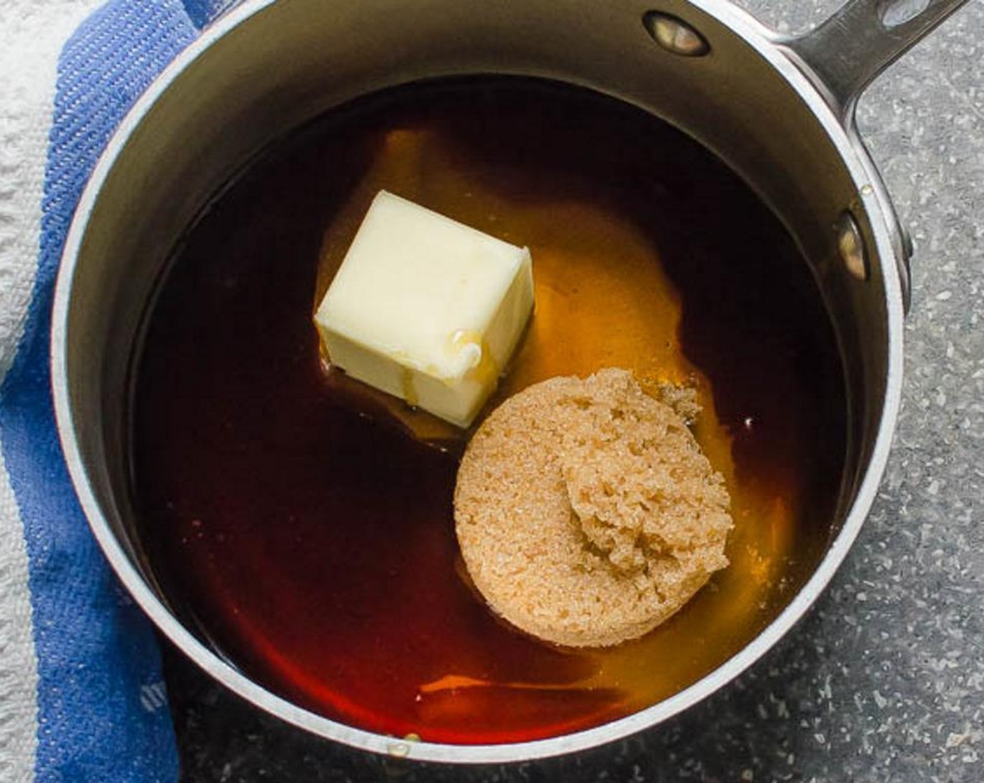 step 5 In a small saucepan over medium heat combine the Butter (3 Tbsp), Honey (1/2 cup) and Brown Sugar (1/4 cup), stirring constantly until the butter has melted and the sugar has dissolved. Stir in the Vanilla Extract (1 tsp) and the spice mixture and set aside.
