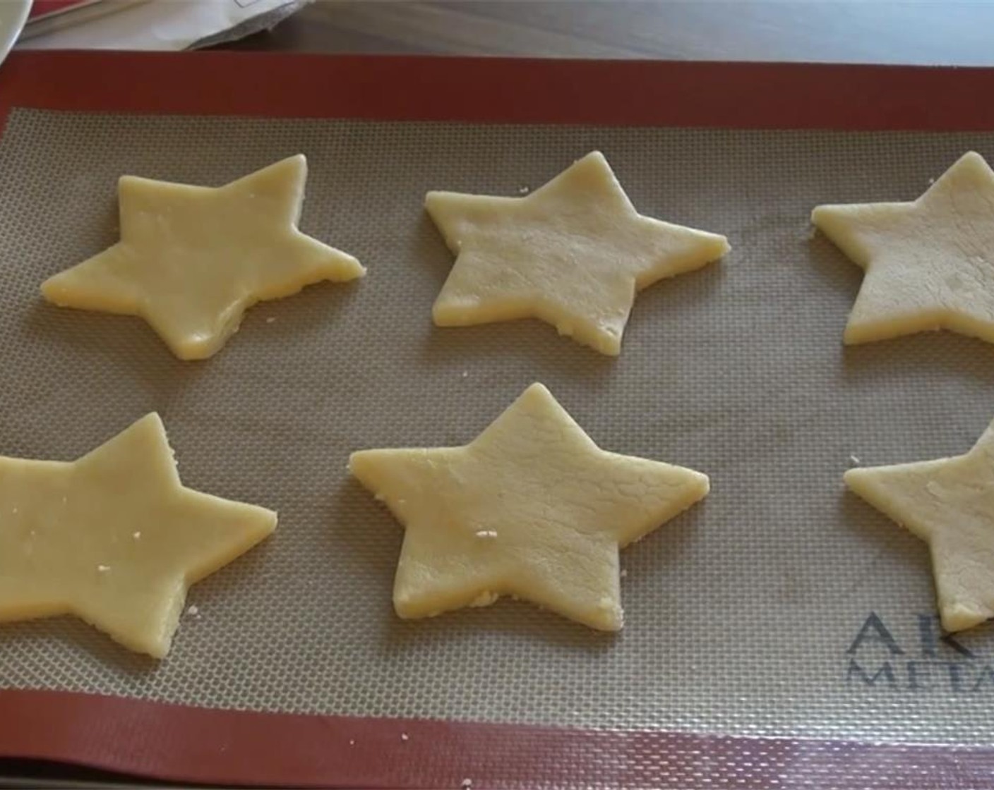 step 7 Carefully transfer cut out cookies to the cookie sheets. Bake 8-9 minutes, or until the edges are lightly browned.