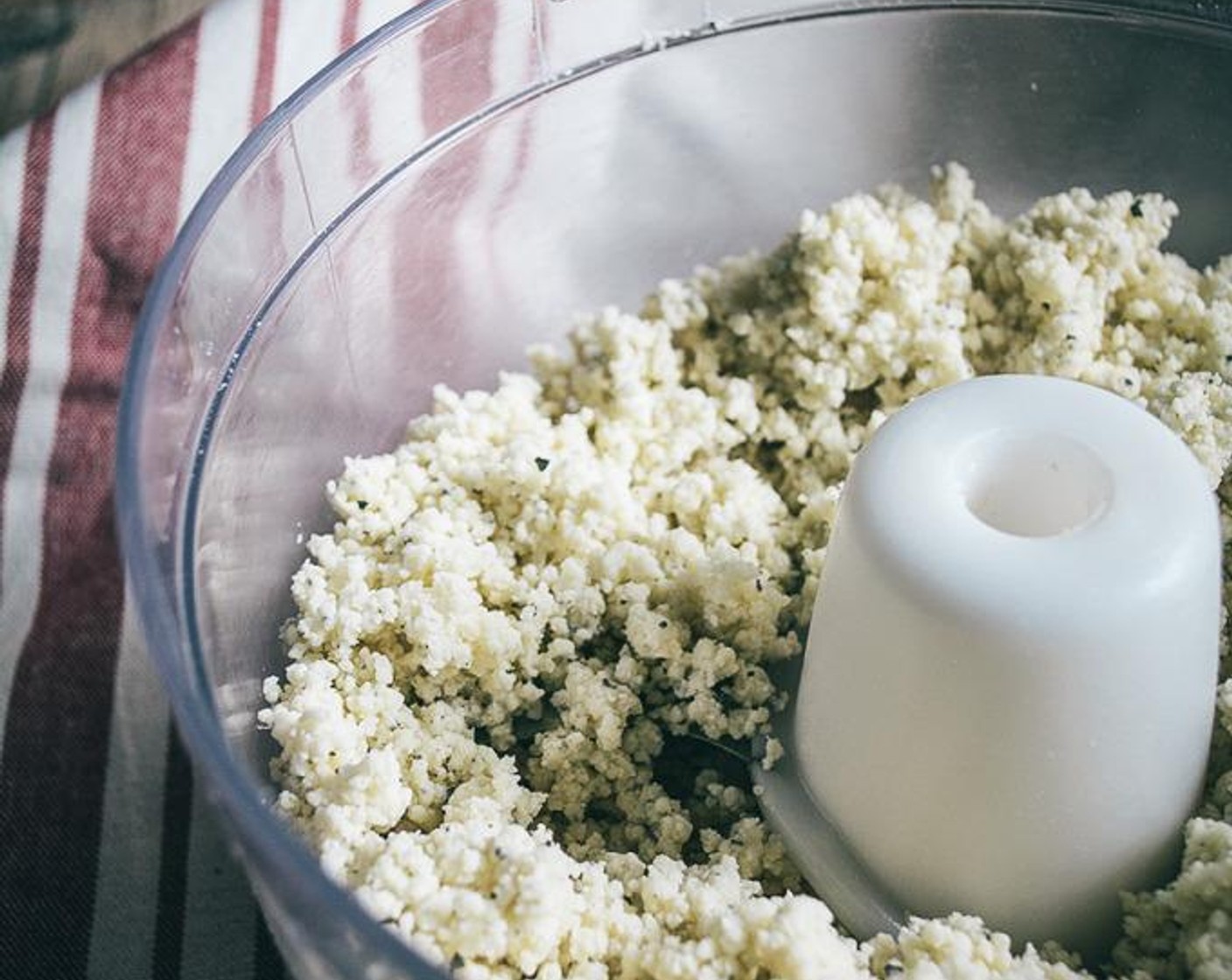 step 2 While the oven heats, add Gluten-Free All-Purpose Flour (1 cup), Coconut Flour (1/4 cup), Sea Salt (1/2 tsp), Dried Basil (1 tsp), Garlic Powder (1/4 tsp), and Onion Powder (1/4 tsp) to bowl of food processor. Pulse 4-5 quick pulses to blend ingredients.