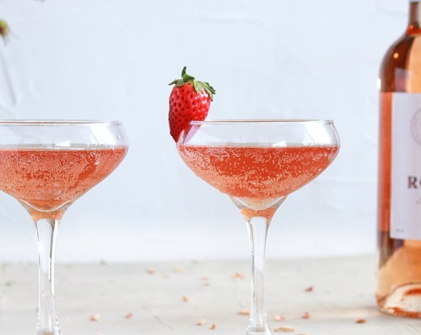 step 4 Place 1.5 oz of Strawberry Rose Simple Syrup, Soda Water (1 fl oz), Rosé Wine (3 fl oz), and Aperol (1 fl oz) into a glass of your choice and stir. Fill to the top with ice and stir again. Garnish with Fresh Strawberry (1).
