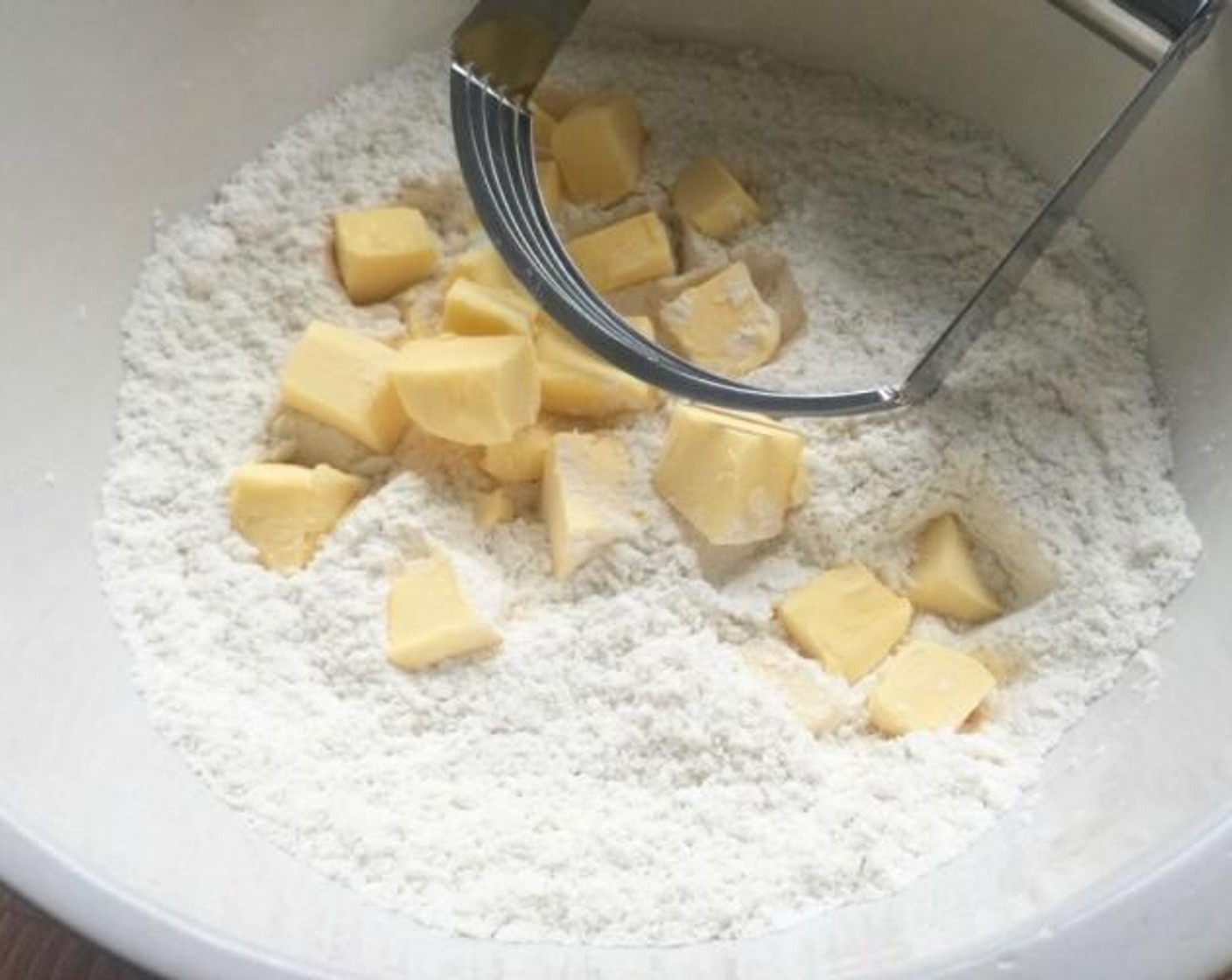 step 4 Cut the Butter (1/2 cup) into small cubes and blend into the flour mixture with a pastry cutter till it resembles coarse crumbs.