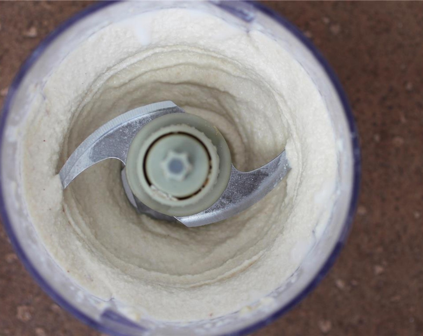 step 6 Melt the Coconut Oil (1/4 cup) on the stovetop or microwave and add to the cashew mixture, and blend well.