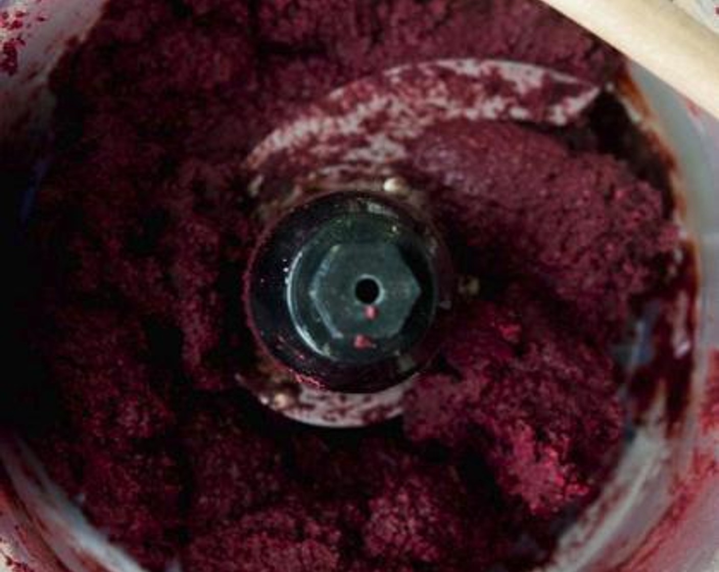 step 1 Into a food processor, add and mix the Beet (1), Cashew Nuts (1 cup), Pink Himalayan Sea Salt (1/8 tsp), Simply Organic Cinnamon, Ground (1/2 tsp), Chocolate Plant-Based Protein Powder (1 scoop), Unsweetened Coconut Flakes (1/2 cup), Unsweetened Cocoa Powder (2 Tbsp), Coconut Oil (1 Tbsp) and Maple Syrup (1 Tbsp).