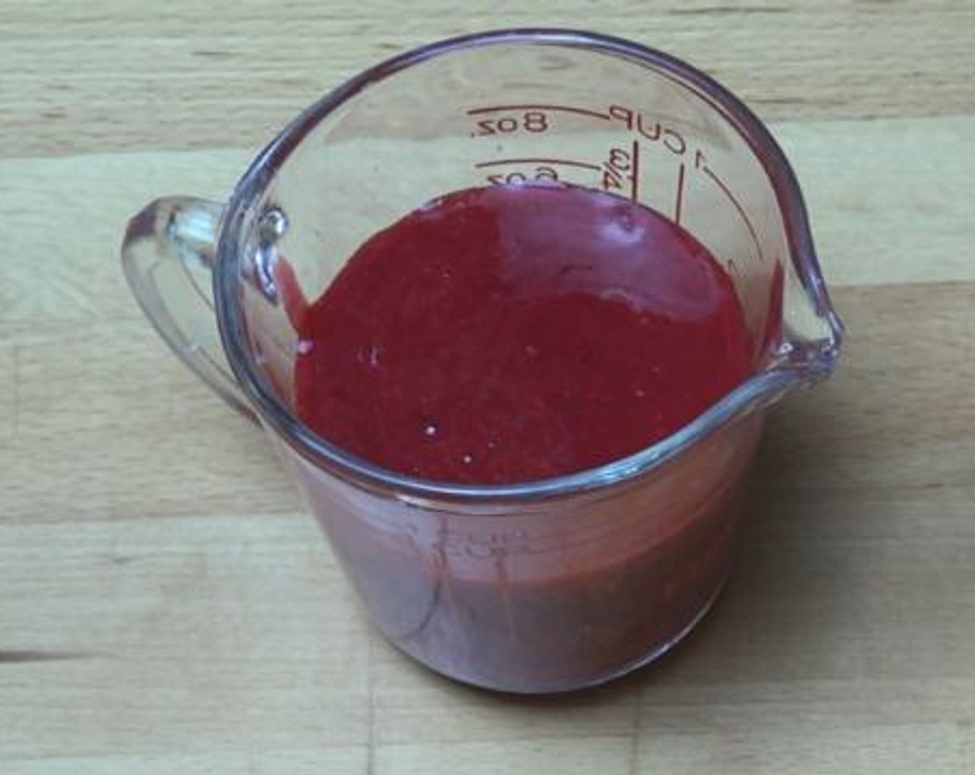 step 4 Inside a blender, mix together the Fresh Raspberry (1 cup), and Powdered Confectioners Sugar (1 Tbsp).