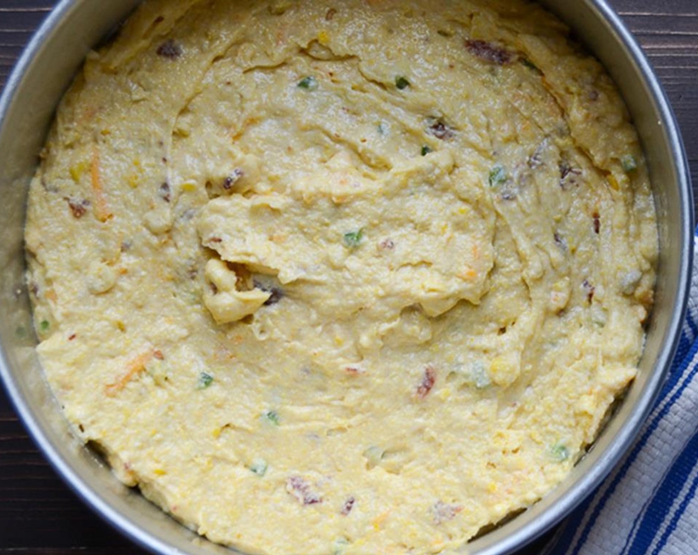 step 9 Transfer the batter to the prepared pan. Smooth the top with a spatula. Bake for 25 to 30 minutes until golden brown.