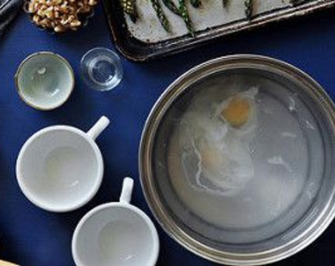 step 10 Stir the water rapidly, creating a whirlpool, and carefully drop in the eggs, one at a time. Turn off the heat and cover the pot or skillet.