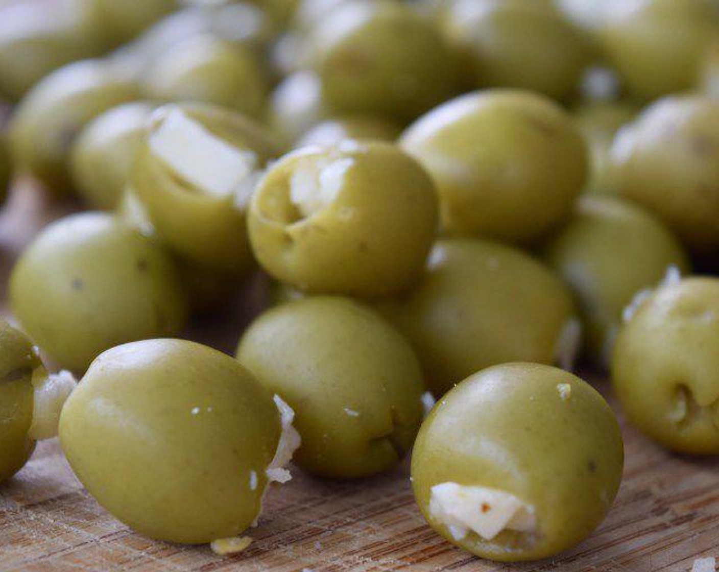 step 2 Slice the Pepper Jack Cheese (1 cup) into small pieces sized to fit in the olives and stuff the olive with the cheese.