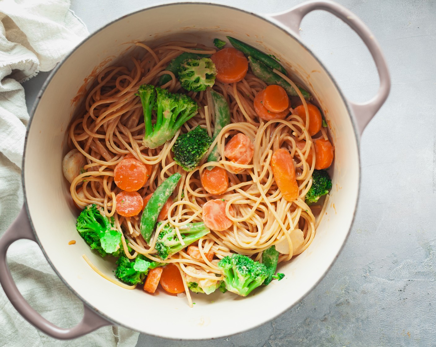 step 5 Return the spaghetti and vegetables to the large pot. Add the peanut sauce and stir to combine.