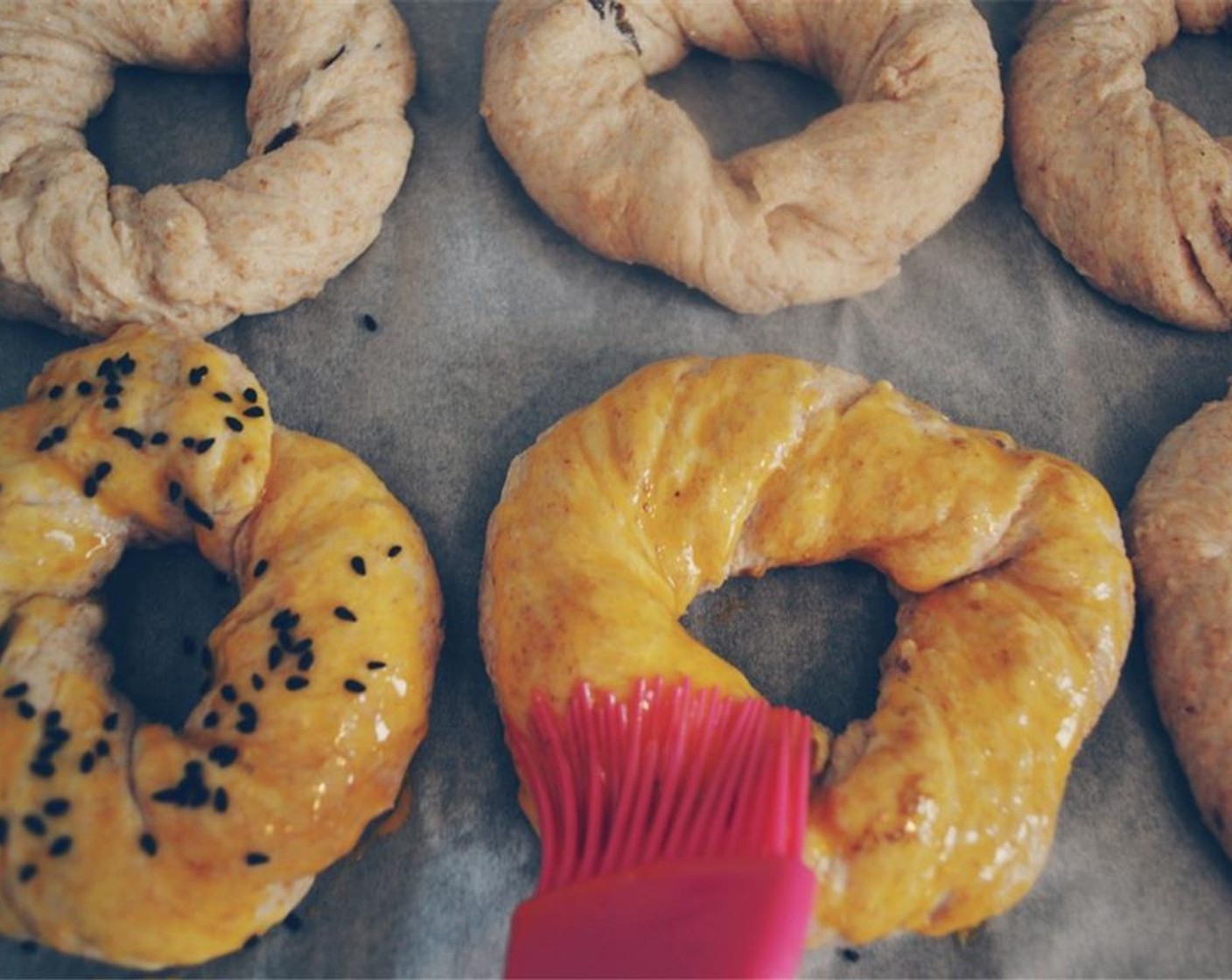 step 11 While the oven is preheating, brush each ring with Egg Yolks and sprinkle with Black Caraway Seeds (1 handful).