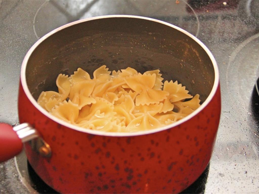 Step 2 of Rainbow Pasta Salad Recipe: Cook the Farfalle Pasta (8 ounce) according to package's instructions. When pasta is finished cooking, transfer pasta to a large colander to drain. Then immediately rinse it in cold water to halt the cooking.