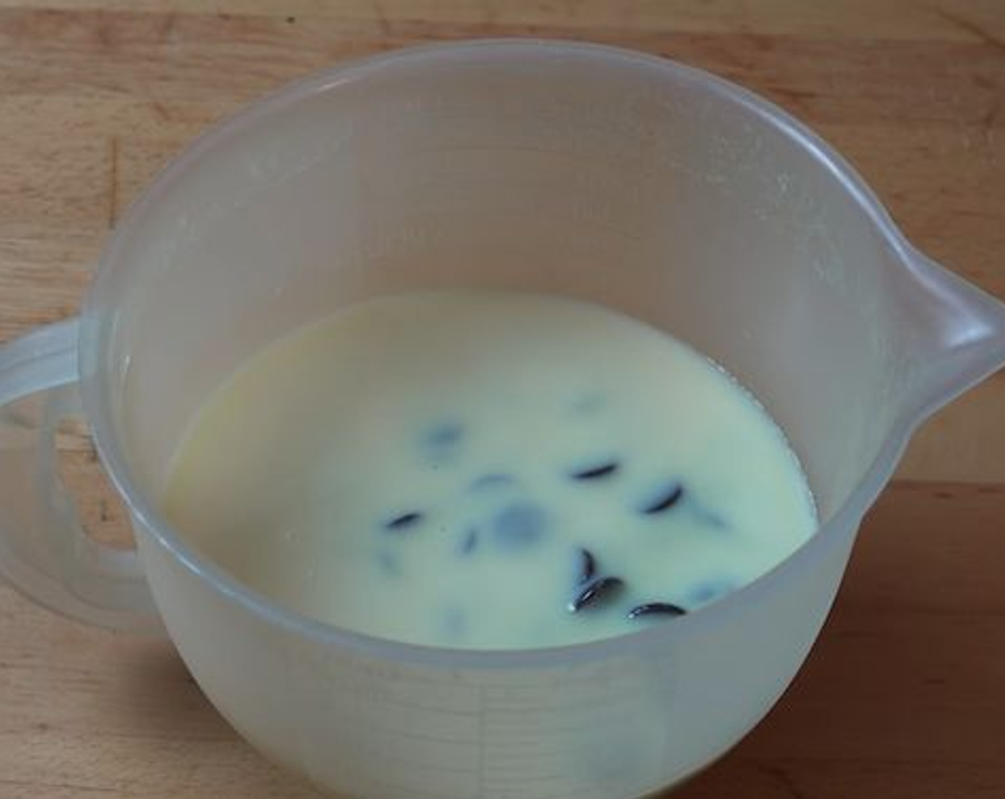 step 2 In a microwave-safe bowl add Dark Chocolate (1 2/3 cups) and Sweetened Condensed Milk (1 can) poured right over the top. Place in the microwave for 1 minute on high.