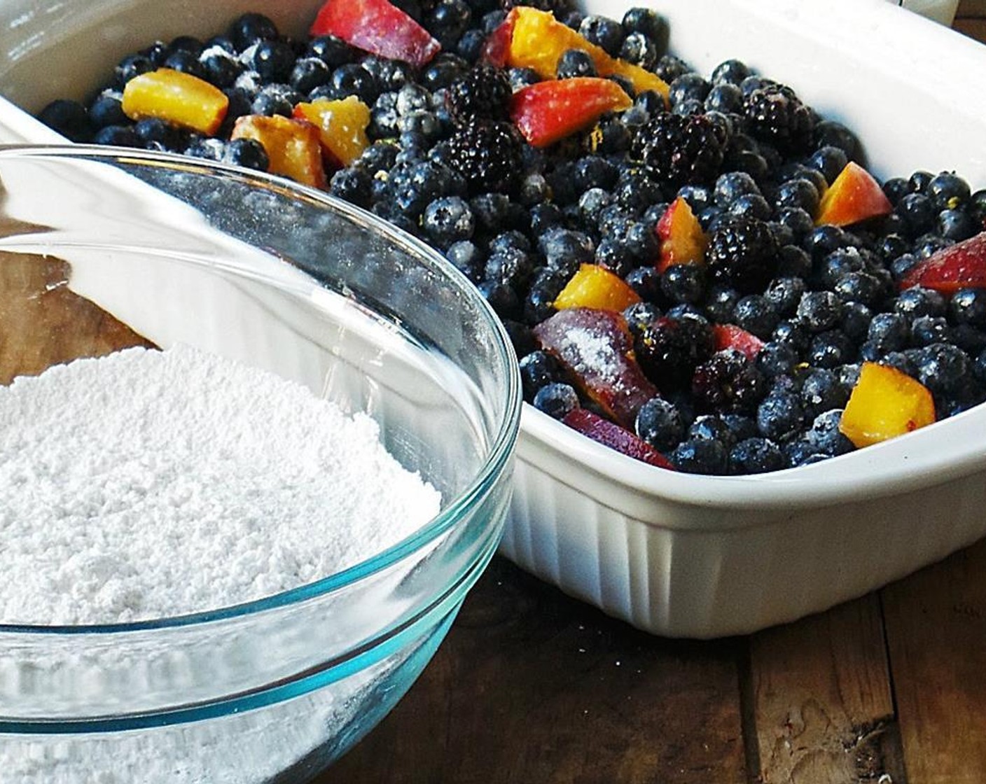 step 2 Mix together the Fresh Blueberries (6 cups), Peaches (5), and Fresh Blackberry (1 handful) with All-Purpose Flour (2 Tbsp), Granulated Sugar (1/4 cup), and the zest of a Lemon (1). Spread into the bottom of a 9x13 baking dish or 11" square. Allow those fruit to juice!