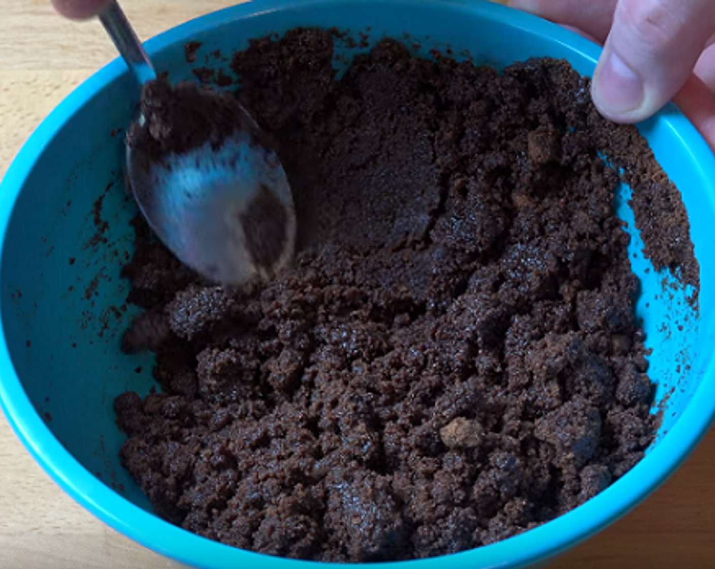 step 1 First, let's make the base of the cheesecake. In a food processor, crumble the Chocolate Cookies (9 oz).Add cookie crumbs to a bowl along with melted Unsalted Butter (1/2 cup) and mix until the combination resembles wet sand.