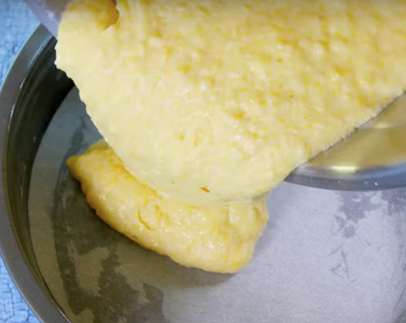 step 4 Pour kefir mixture into the flour mixture. Using rubber spatula, gently fold liquids into flour mixture until just blended (do not stir). Scrape batter into pan; spread evenly.