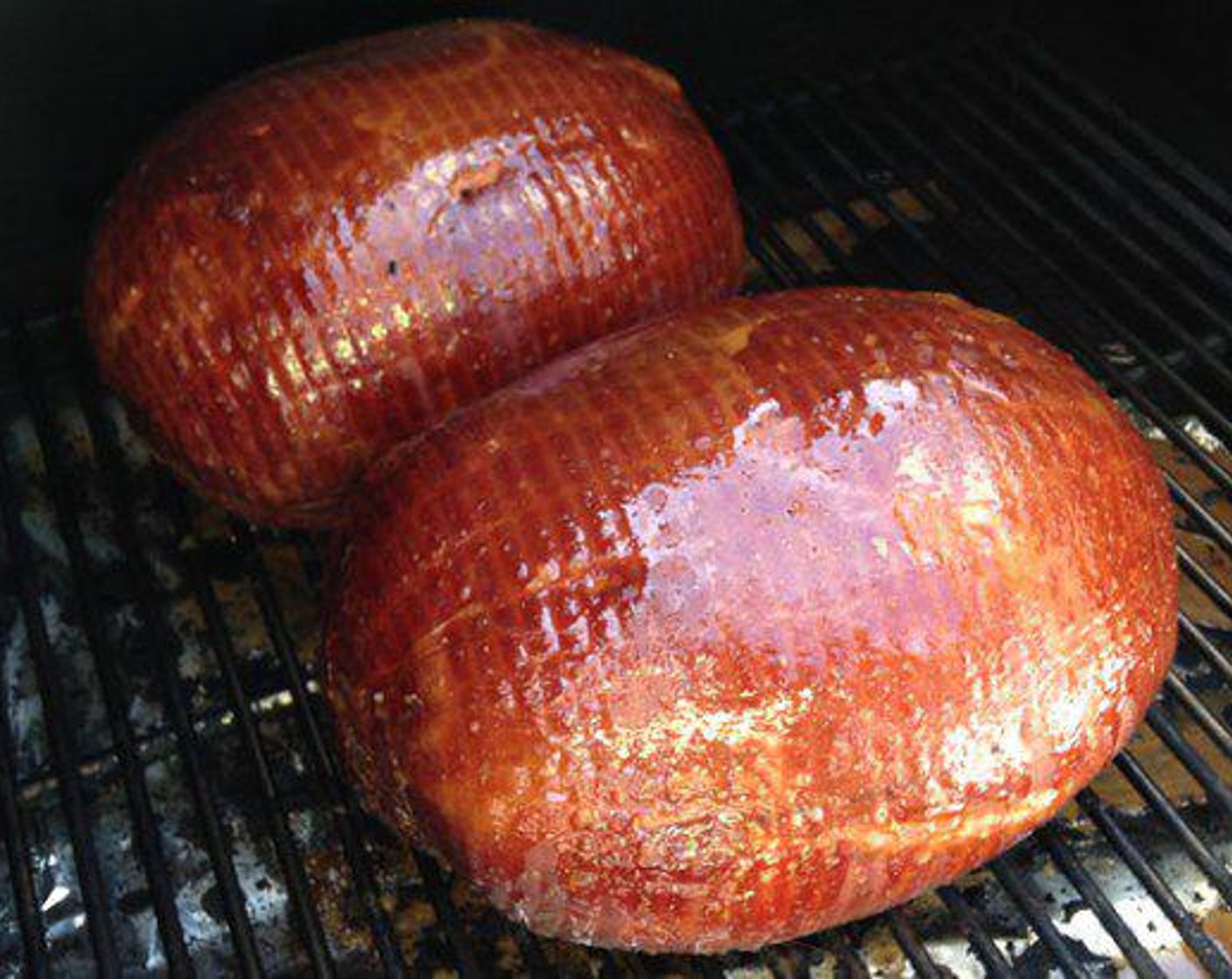 step 4 When the Pit Ham reaches 125-130 degrees F (51-54 degrees C) internally, it’s time to glaze. Squirt or brush the glaze over the top and sides of the Ham. The heat will melt the glaze and cause it to run all over the outside. The glaze needs to cook on for 30-45 minutes and at this point, the Pit Ham should be 140 degrees F (60 degrees C).