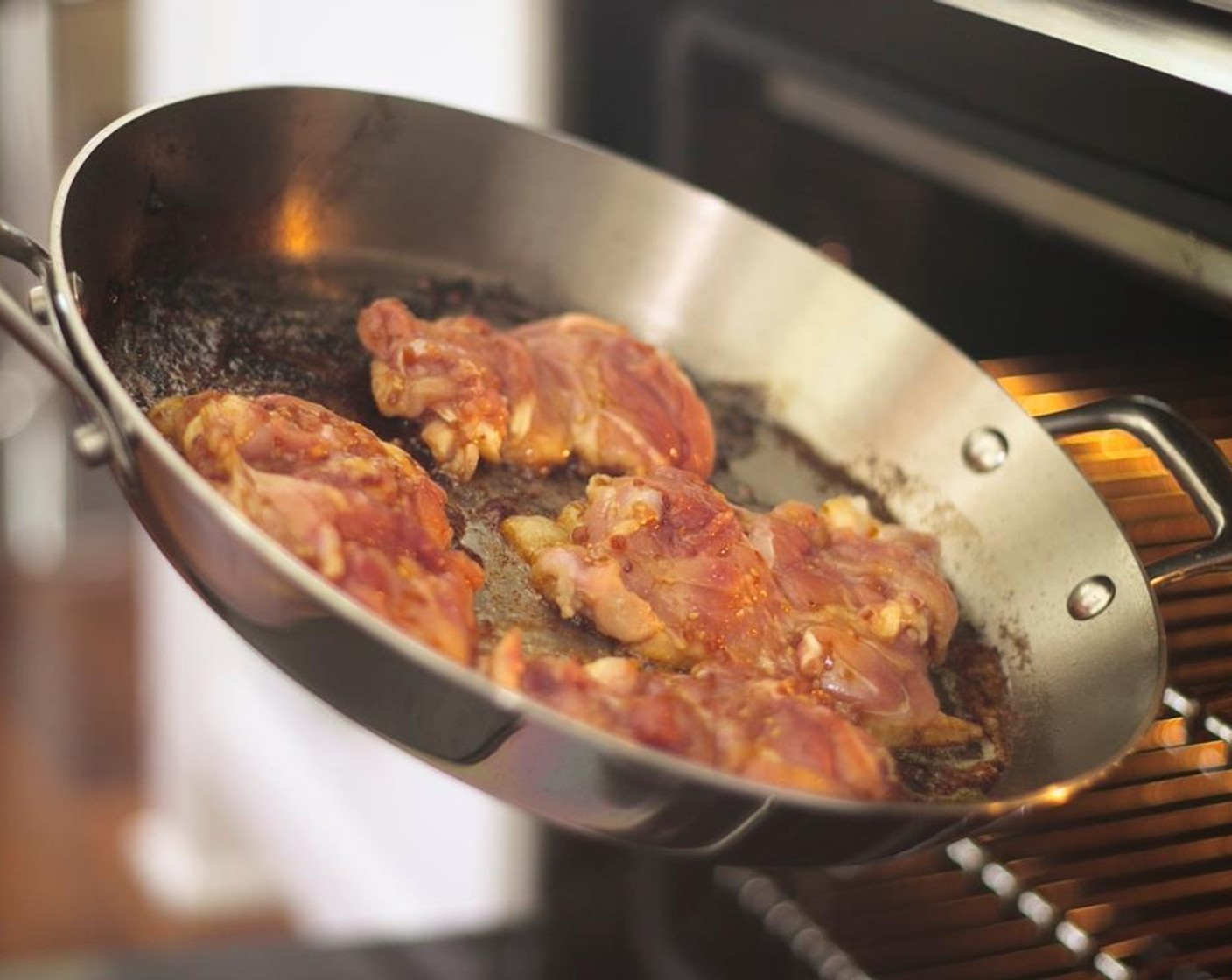 step 8 Remove pan from heat. Soak up grease with paper towels. Place saute pan with chicken, skin side down, in oven.