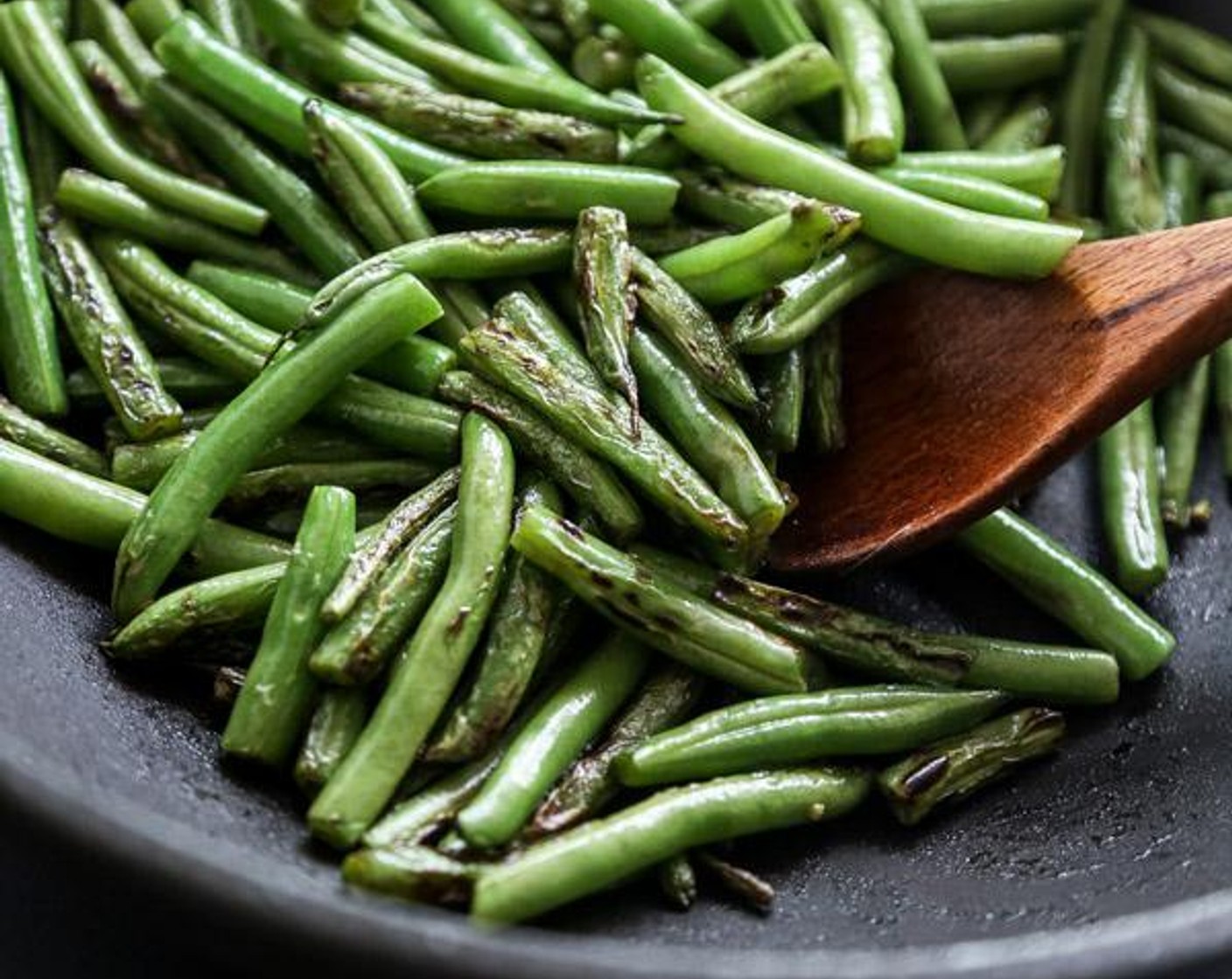 step 2 Add the tipped, tailed, and halved Green Beans (4 cups) and cook, stirring, until they're charred in spots and just tender, about 5 minutes. Transfer the beans to a bowl and set them aside.