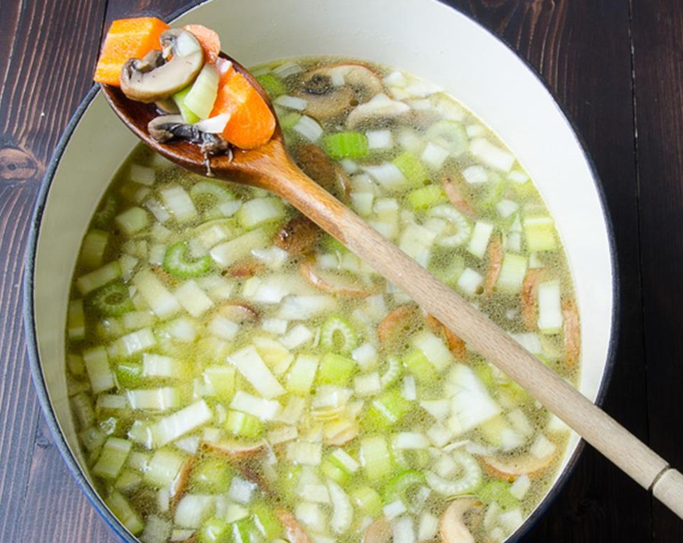 step 8 Flip to brown the other side. Pour the chicken broth over the mushrooms and add the Carrots (4), Celery (3 stalks), and Onion (1). Bring the broth to a boil and reduce heat to simmer until vegetables are tender, about 15 minutes.