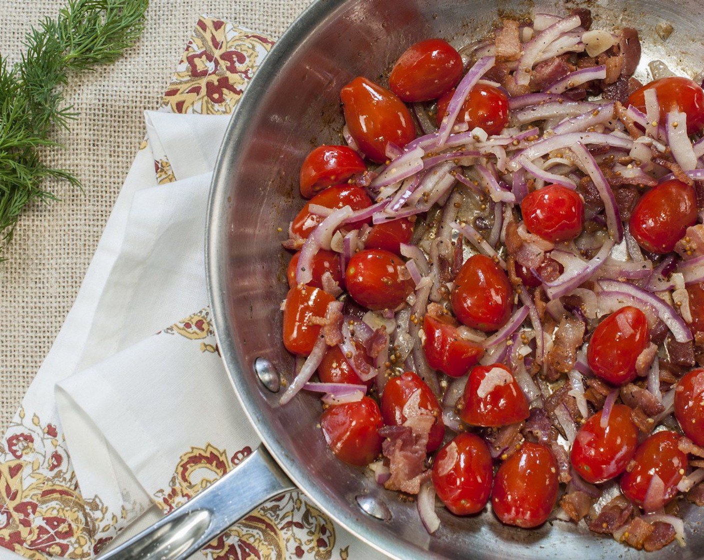 step 10 Stir in Cherry Tomatoes (2 cups) and cook, tossing often for 1 minute. Pour in dressing and add bacon, stir to combine.