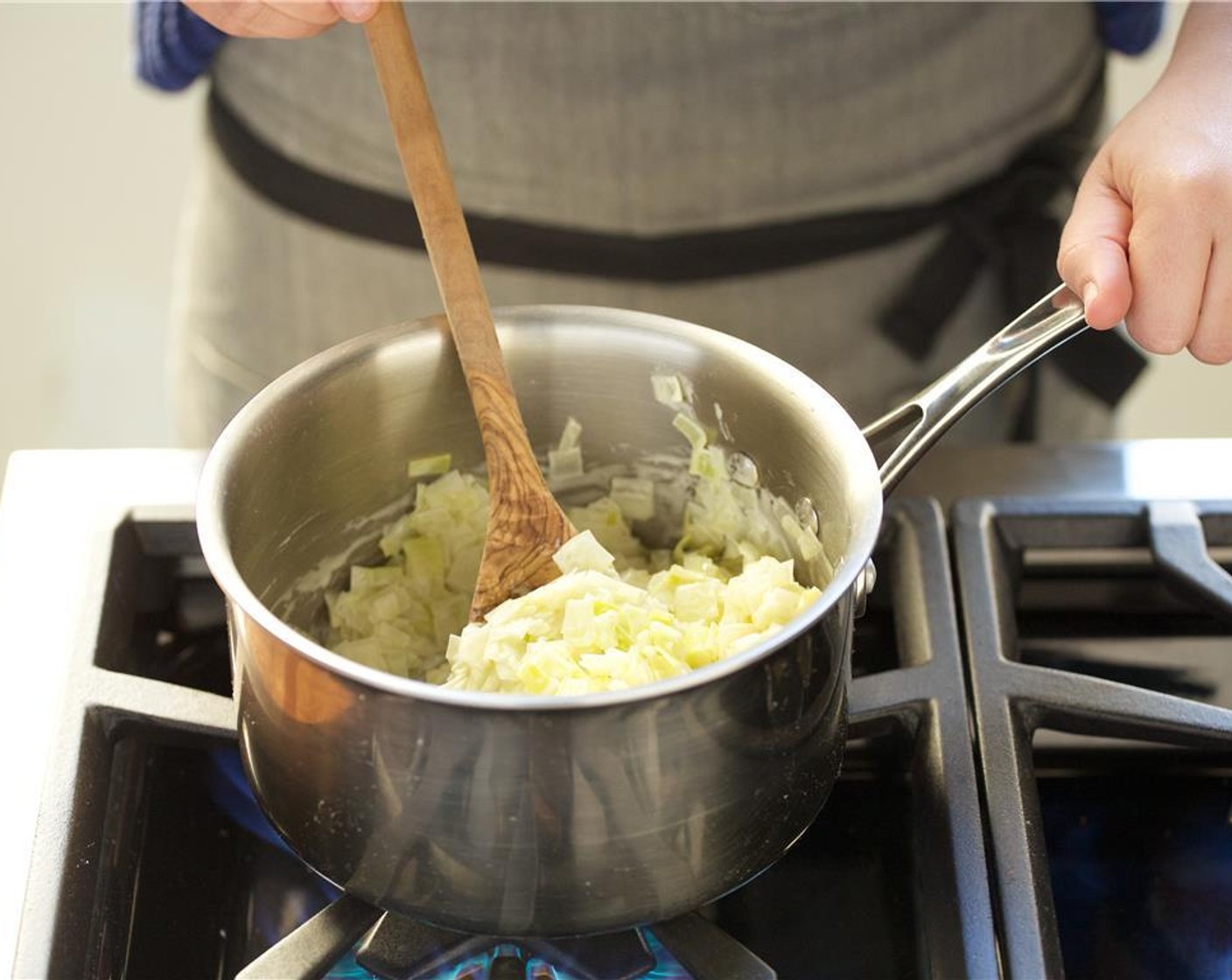 step 7 Meanwhile, return the leeks back to medium low heat and let simmer for three minutes. Remove from heat and set aside for plating.