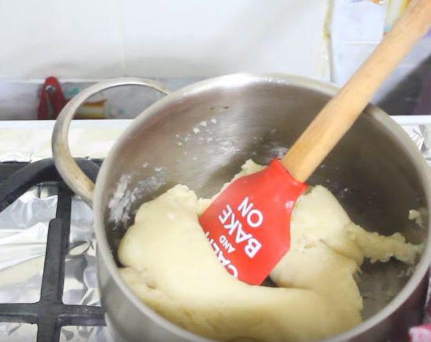 step 4 Add All-Purpose Flour (1 cup). Turn the heat down and stir the mixture until it comes together into a ball.
