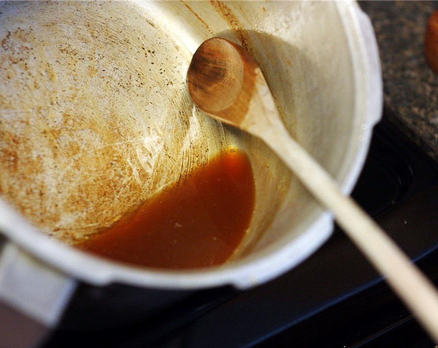 step 3 Stir the cider. When it has reduced to half a cup, you can remove it from the heat.