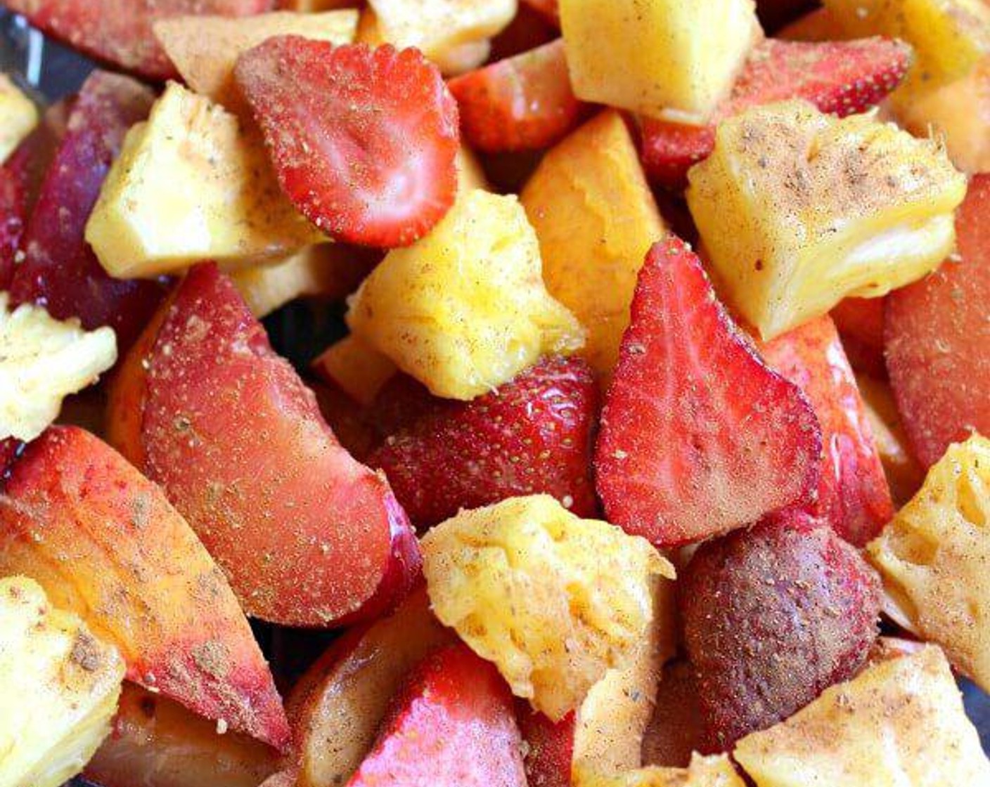 step 2 Arrange Nectarines (2), Plums (3), Fresh Strawberry (1 cup), and Pineapple (1 cup) in a baking dish.