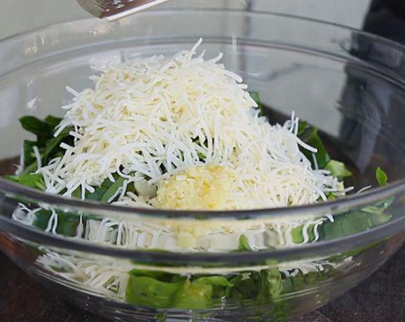 step 2 In a large bowl, mix together Philadelphia Original Soft Cheese (1 pckg), Artichoke Hearts (1 can), Fresh Baby Spinach (1 cup), Shredded Italian Blend Cheese (1 cup), Parmesan Cheese (1/4 cup), Garlic (2 cloves), Onion Powder (1/2 tsp), Salt (to taste), and Ground Black Pepper (to taste).