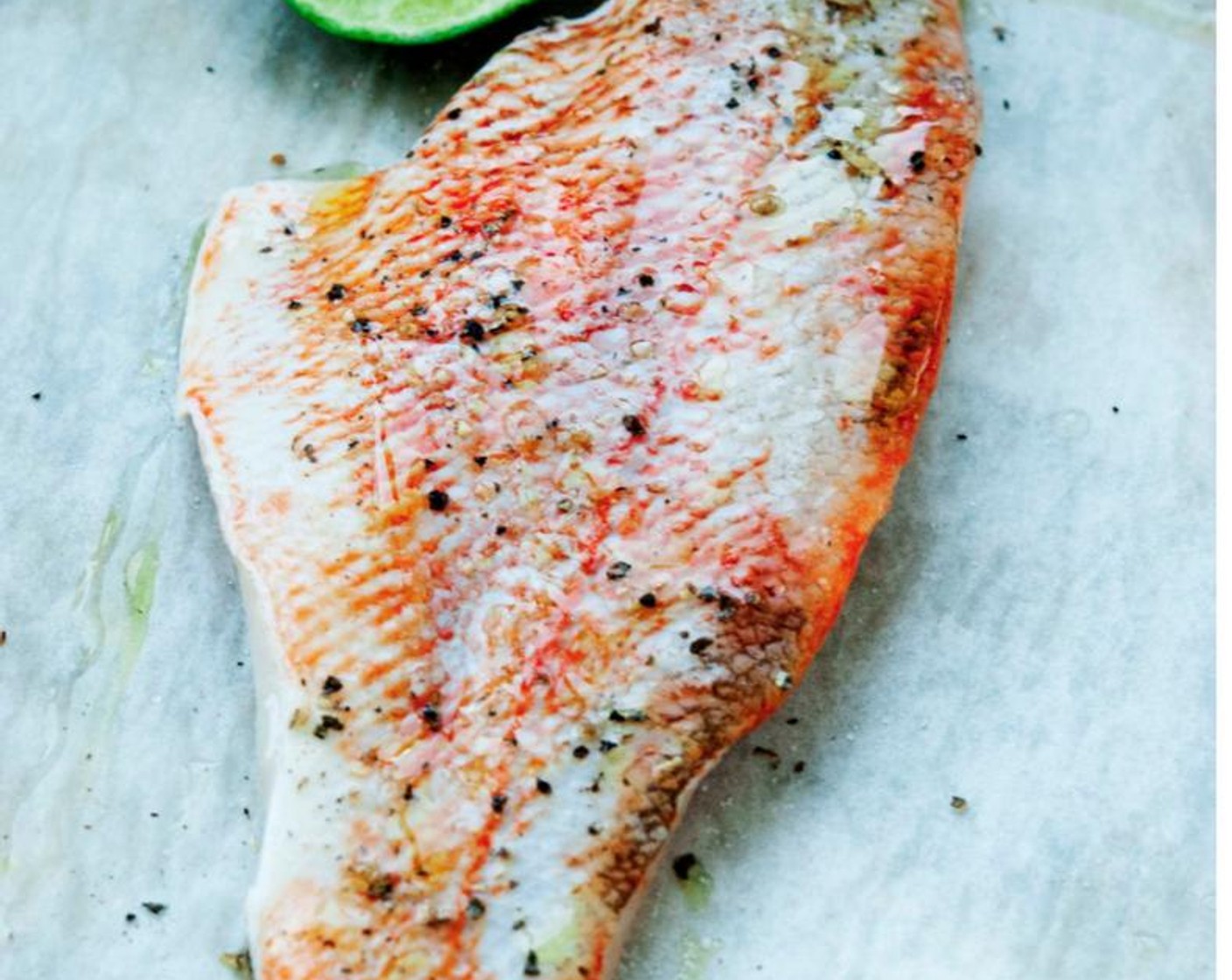 step 2 Season Red Snapper Fillet (1) with Salt (to taste), Ground Black Pepper (to taste), and Extra-Virgin Olive Oil (1 Tbsp). Squeeze Lime (1/2) on it, too.